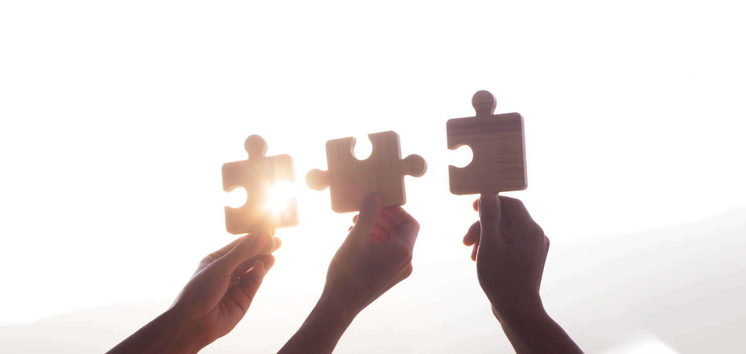 jigsaw puzzle. Charity, volunteering, business solutions, success and strategic ideas. Unity in business as a team